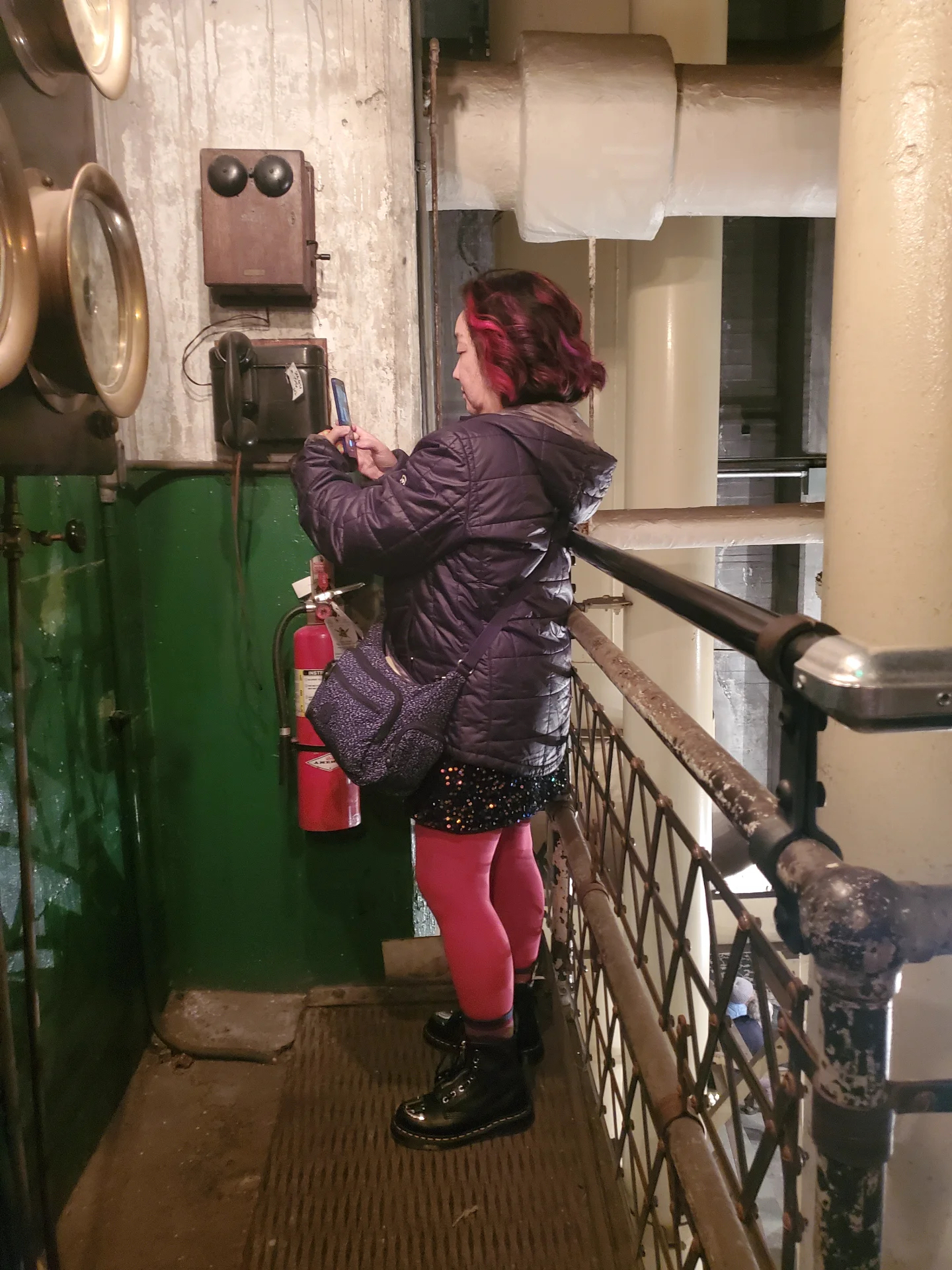 Zinnia Su of Trash Panda Go Kart on the phone @ Georgetown Steamplant